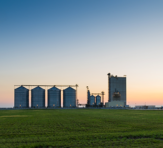 Grain bins at dusk